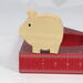 Handmade wooden pig toy, sustainable wood, scroll saw cut, sanded smooth. 1.75", 2", or 2.5" sizes, natural finish for stacking or play.